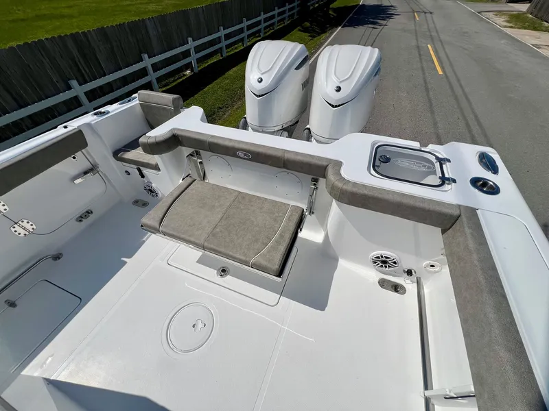 Slide: The Image of 2025 Sea Hunt Gamefish 30 with Coffin Box, featuring dual engines and spacious deck. - 7