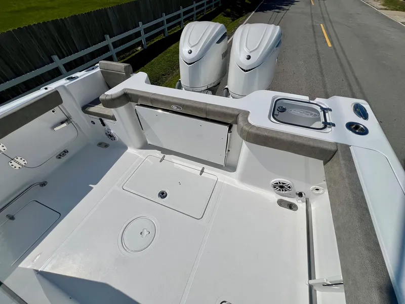 Slide: The Image of 2025 Sea Hunt Gamefish 30 boat deck with twin engines and coffin box. - 8