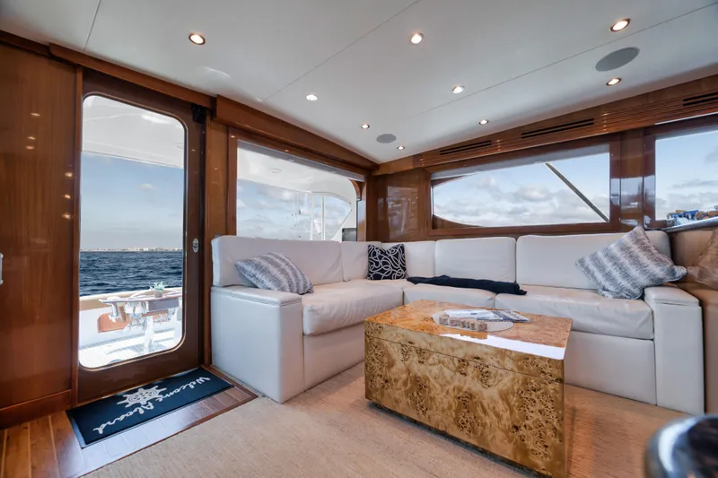 Slide: The Image of Luxurious interior of 2009 Hatteras 60GT yacht with plush seating and ocean view. - 11