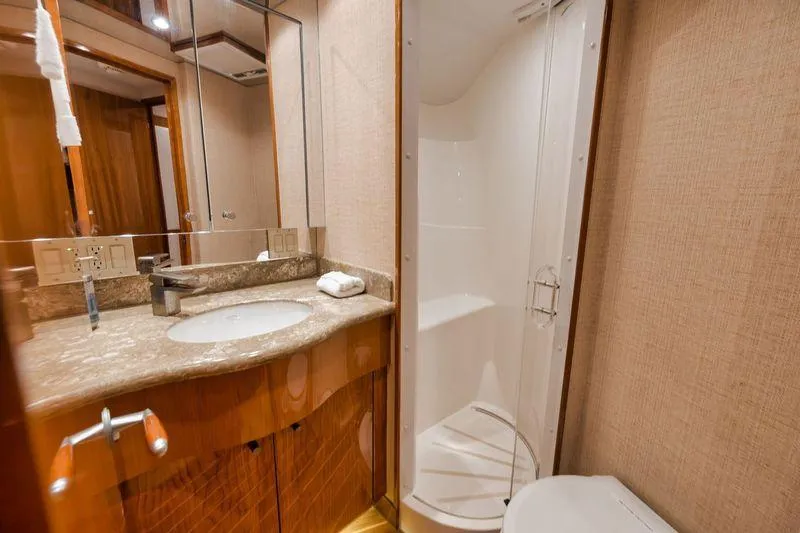 Slide: The Image of Luxurious bathroom in 2009 Hatteras 60GT yacht with modern fixtures and shower. - 18