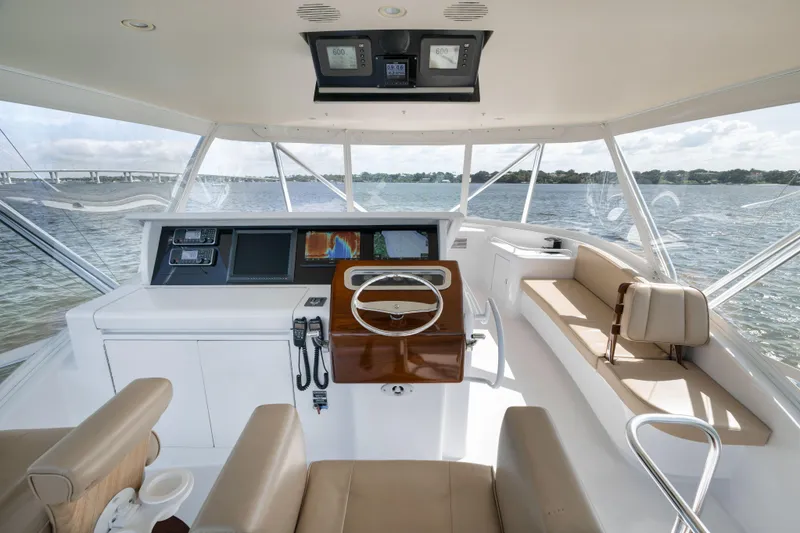 Slide: The Image of Helm of 2009 Hatteras 60GT yacht with modern controls and panoramic view. - 28