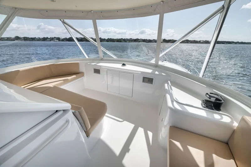 Slide: The Image of Luxurious 2009 Hatteras 60GT yacht interior with beige seating and ocean view. - 30