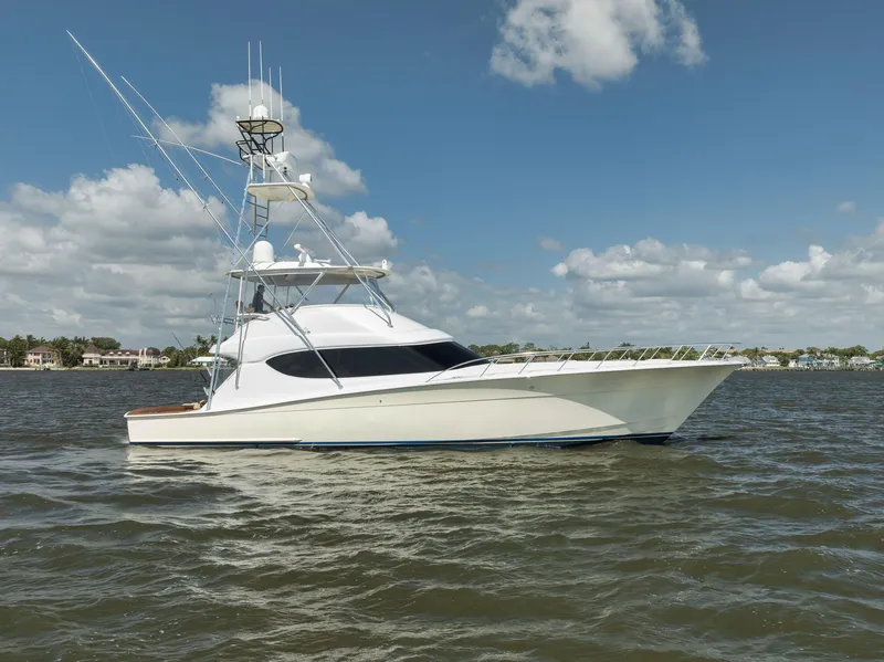 Slide: The Image of 2009 Hatteras 60GT yacht on water under blue sky with clouds. - 4