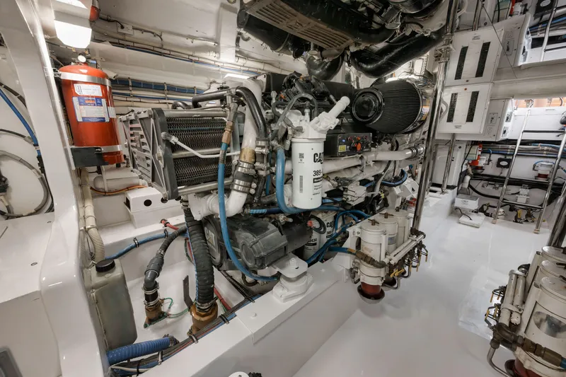 Slide: The Image of Engine room of 2009 Hatteras 60GT yacht, featuring complex machinery and equipment. - 47
