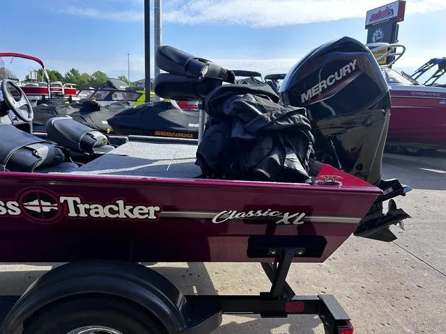 Slide: The Image of 2021 Tracker BASS TRACKER® Classic XL boat with Mercury engine, parked outdoors. - 6