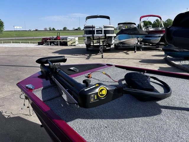 Slide: The Image of 2021 Tracker BASS TRACKER® Classic XL boat with trolling motor on deck, parked outdoors. - 8