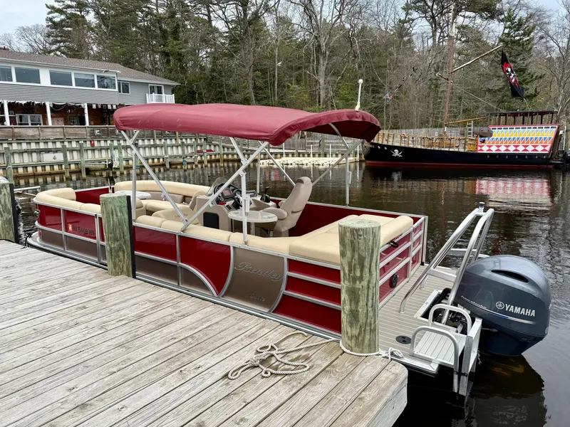 Slide: The Image of 2019 Bentley Pontoons 223 Elite docked with Yamaha motor, red canopy, and beige seating. - 5
