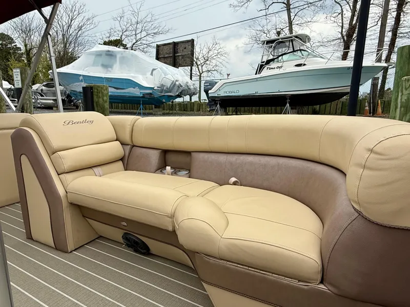 Slide: The Image of 2019 Bentley Pontoons 223 Elite with luxurious beige seating and sleek design. - 8