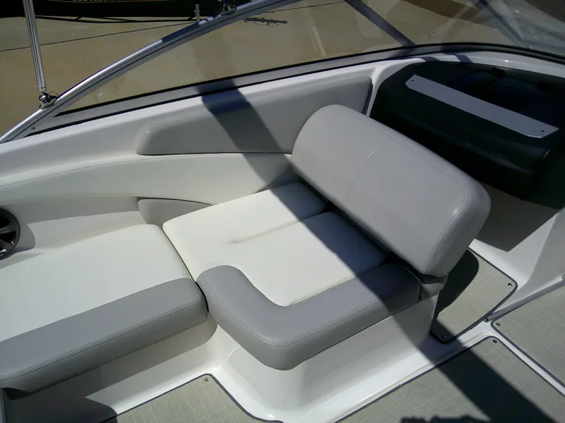 Slide: The Image of 2020 Regal 1900 ES Bowrider interior with gray and white seating. - 10