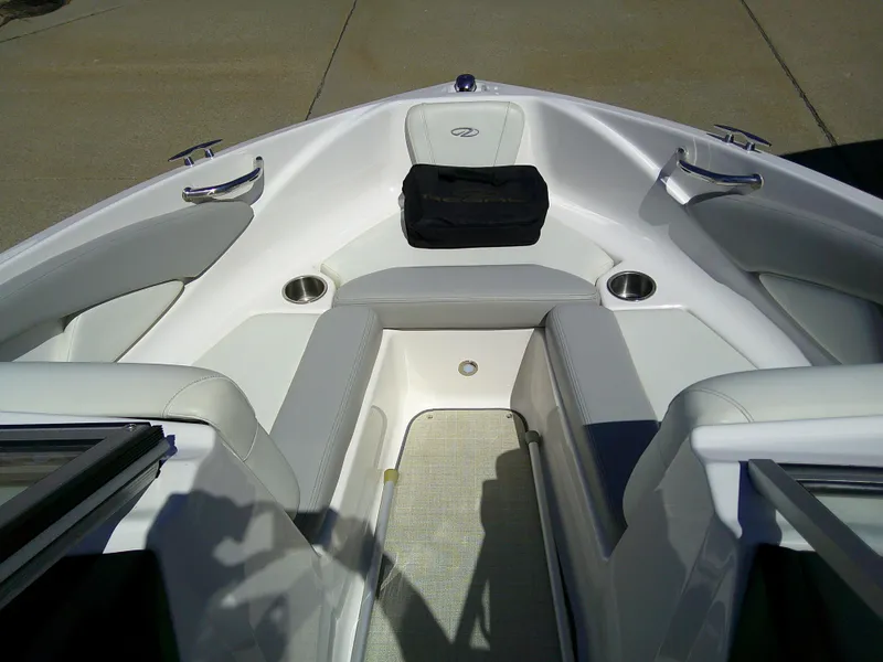 Slide: The Image of 2020 Regal 1900 ES Bowrider interior with cushioned seating and cup holders. - 11
