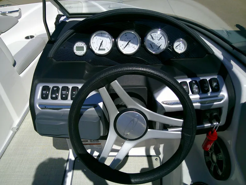 Slide: The Image of 2020 Regal 1900 ES Bowrider dashboard with steering wheel and gauges. - 14