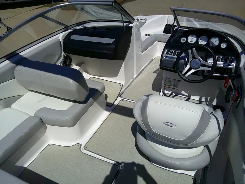 Slide: The Image of 2020 Regal 1900 ES Bowrider interior with sleek seating and modern dashboard design. - 7