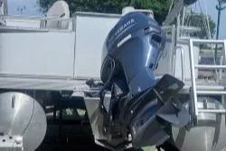 Slide: The Image of 2021 Avalon VTX Quad Fish boat with Yamaha outboard motor, docked outdoors. - 4