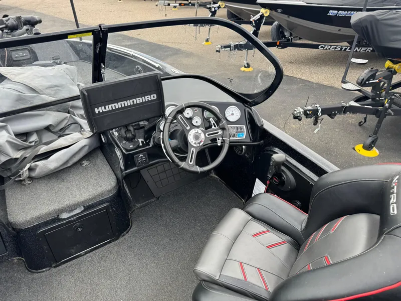 Slide: The Image of Black and red Nitro ZV21 boat seats, 2019 model, in a workshop setting. - 12