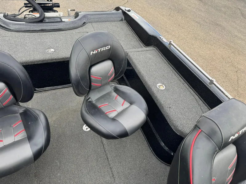 Slide: The Image of 2019 Nitro ZV21 boat interior with black and red seats. - 14