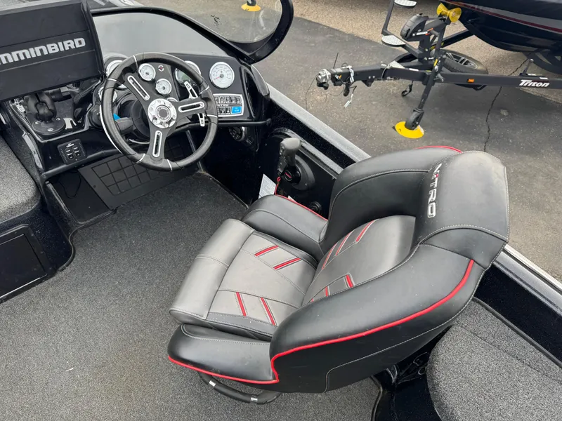 Slide: The Image of Interior storage compartment of a 2019 Nitro ZV21 boat, featuring a blue interior. - 18