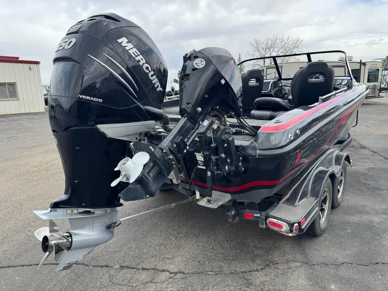 Slide: The Image of 2019 Nitro ZV21 boat on trailer in warehouse setting. - 2