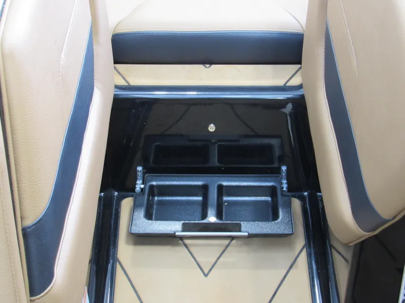 Slide: The Image of 2022 Malibu Wakesetter 23 LSV interior with tan and black seating and cup holders. - 10