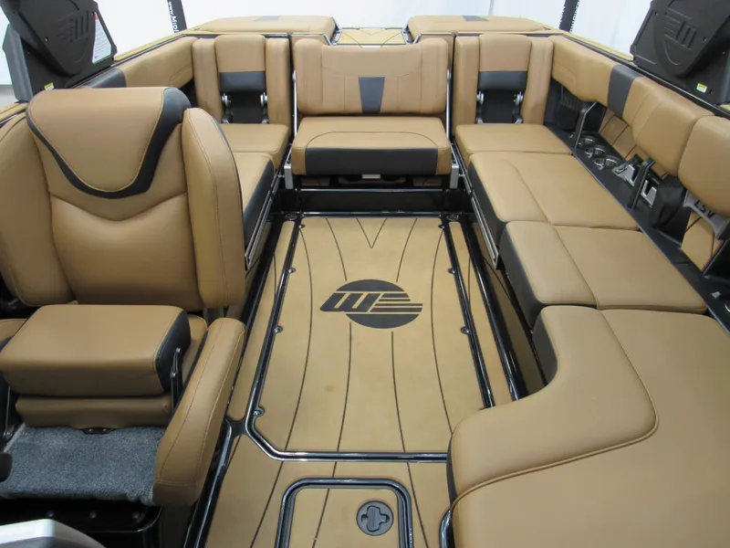 Slide: The Image of 2022 Malibu Wakesetter 23 LSV interior with tan leather seating and logo on floor. - 11