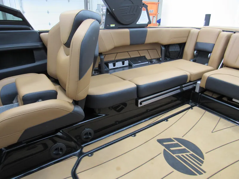 Slide: The Image of 2022 Malibu Wakesetter 23 LSV interior with tan and black seating, showcasing luxury design. - 7