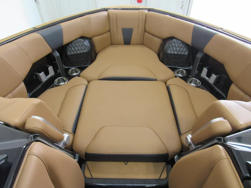 Slide: The Image of 2022 Malibu Wakesetter 23 LSV interior with tan leather seating and cup holders. - 9