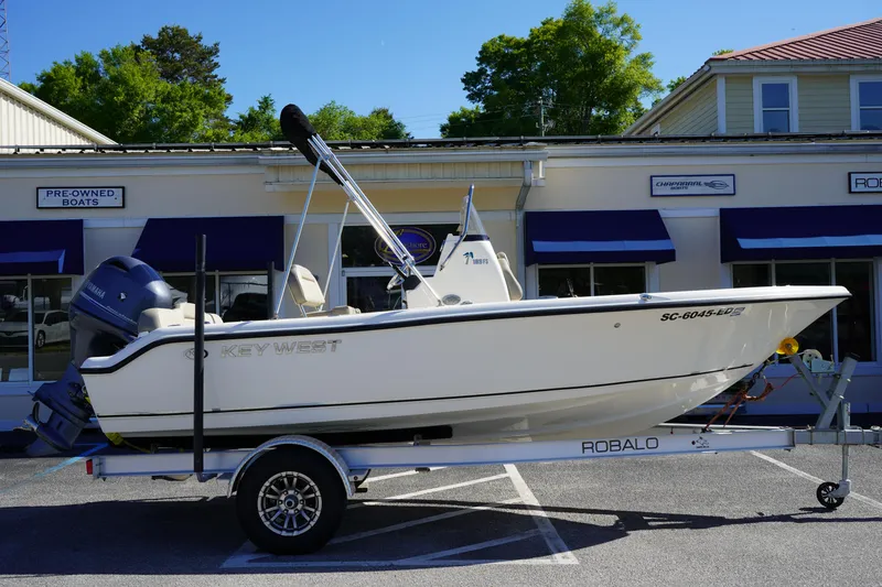 Slide: The Image of 2023 Key West 189 FS boat on trailer outside dealership. - 0