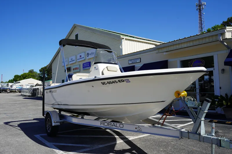 Slide: The Image of 2023 Key West 189 FS boat on Robalo trailer outside dealership. - 1