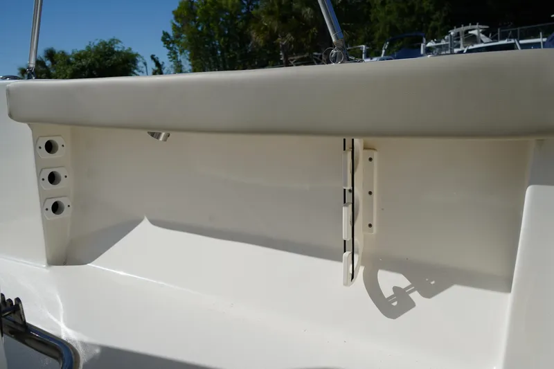 Slide: The Image of 2023 Key West 189 FS boat interior detail with rod holders and seating. - 11