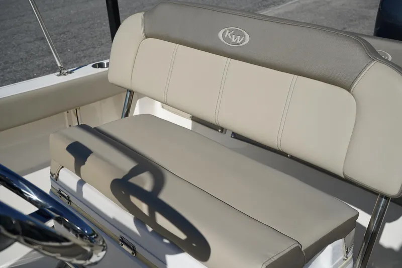 Slide: The Image of 2023 Key West 189 FS boat seat with beige upholstery and KW logo. - 13