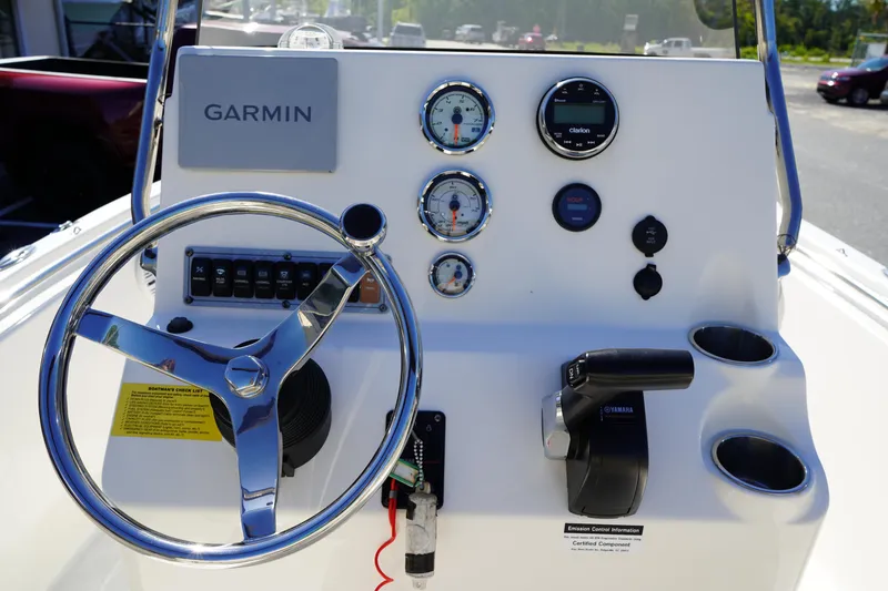 Slide: The Image of 2023 Key West 189 FS boat dashboard with Garmin navigation and control gauges. - 14