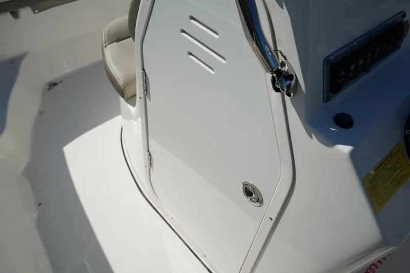 Slide: The Image of 2023 Key West 189 FS boat console with storage compartment and seat. - 17