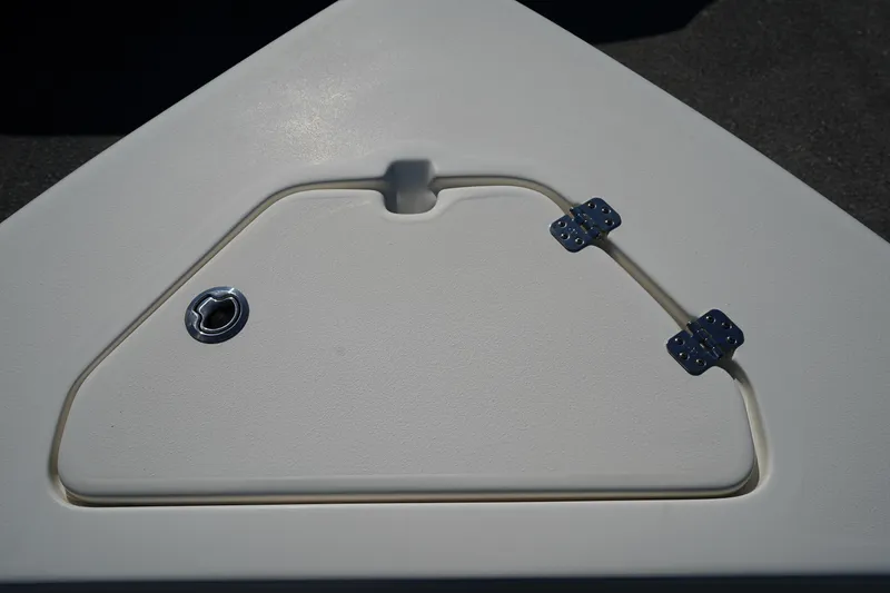 Slide: The Image of 2023 Key West 189 FS boat compartment with metal hinges and latch. - 22