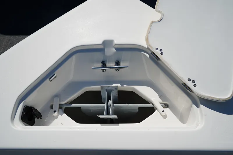Slide: The Image of Anchor storage compartment on 2023 Key West 189 FS boat, open lid, white interior. - 23