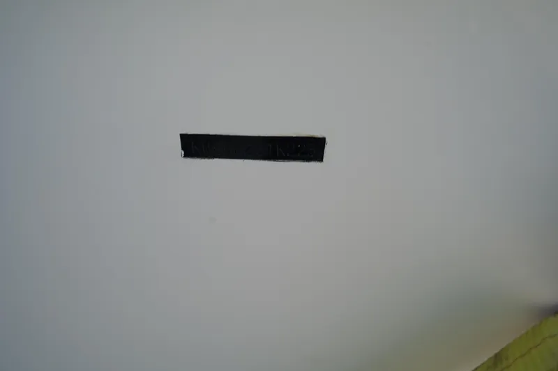 Slide: The Image of Black strip on a white surface, possibly part of a 2023 Key West 189 FS boat. - 24