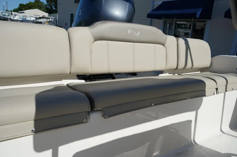 Slide: The Image of 2023 Key West 189 FS boat interior with beige seating and backrest. - 7