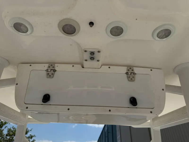 Slide: The Image of 2015 Sea Hunt Ultra 234 boat console with storage compartment and lights. - 13