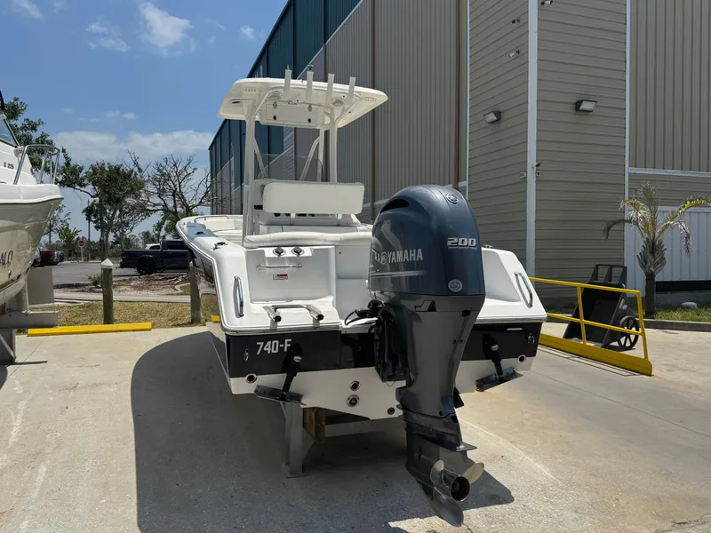 Slide: The Image of 2015 Sea Hunt Ultra 234 boat with Yamaha 200 engine, parked outdoors. - 7