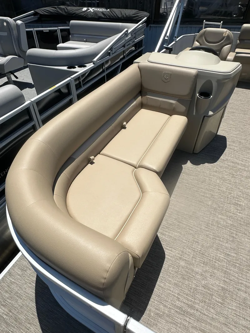 Slide: The Image of 2025 Godfrey Xperience 2086 CXP pontoon boat with beige seating and modern design. - 10