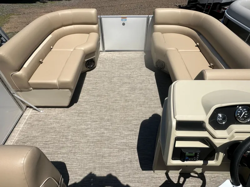Slide: The Image of 2025 Godfrey Xperience 2086 CXP pontoon boat interior with beige seating and helm. - 18