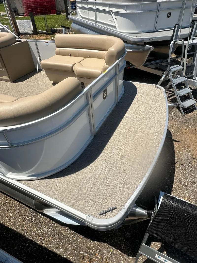 Slide: The Image of 2025 Godfrey Xperience 2086 CXP pontoon boat with beige seating and spacious deck. - 8