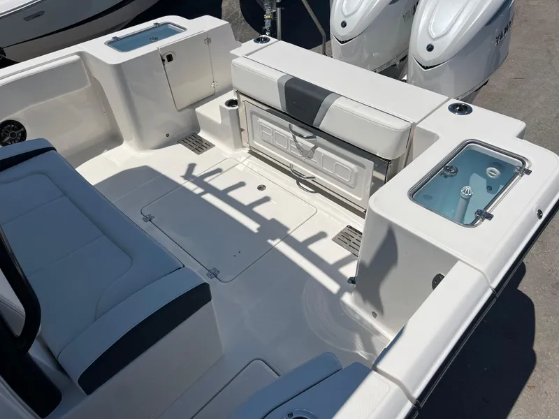 Slide: The Image of 2025 Robalo R300 Center Console boat interior with seating and storage compartments. - 19