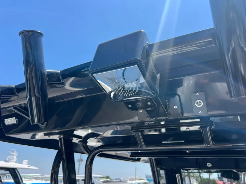 Slide: The Image of 2025 Robalo R300 Center Console boat deck with storage and livewell. - 21