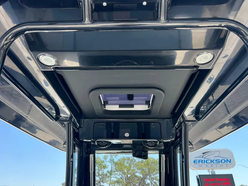 Slide: The Image of 2025 Robalo R300 Center Console boat interior roof with hatch and speakers. - 22