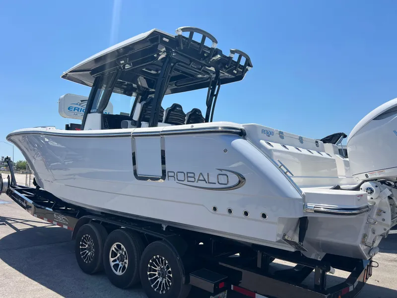 Slide: The Image of 2025 Robalo R300 Center Console with twin 350 V6 outboard engines, rear view. - 5