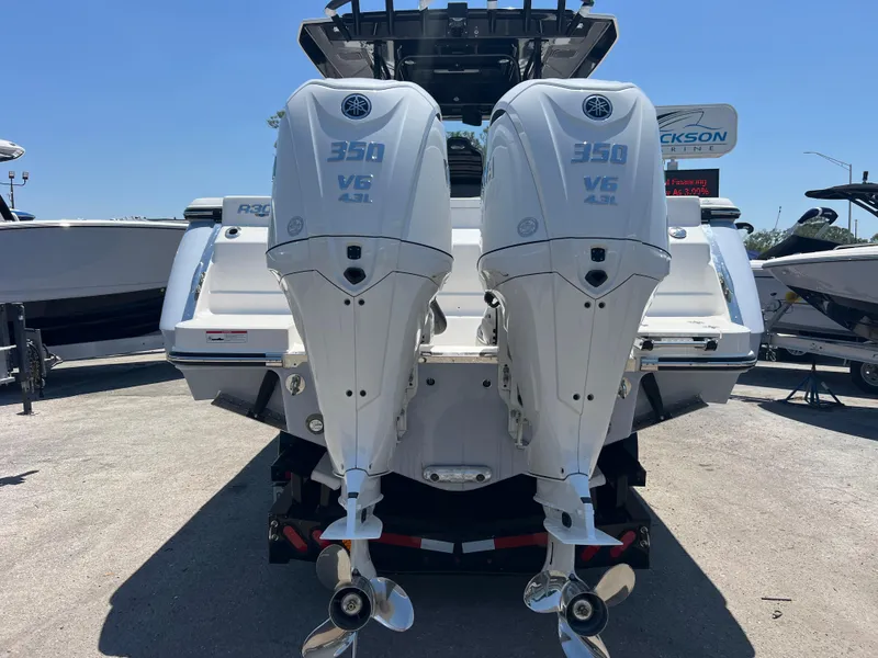 Slide: The Image of 2025 Robalo R300 Center Console boat interior with seating and storage compartments. - 6