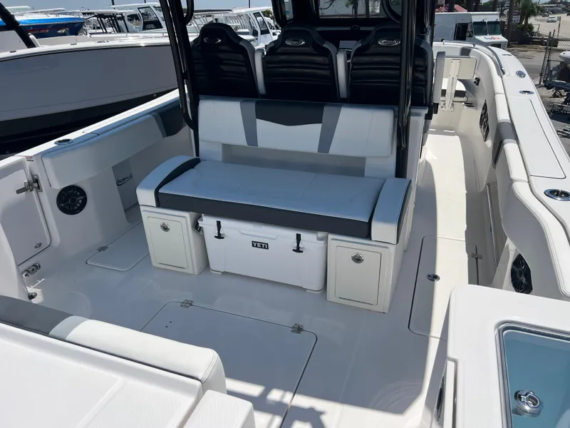 Slide: The Image of 2025 Robalo R300 Center Console boat interior with seating and storage. - 8