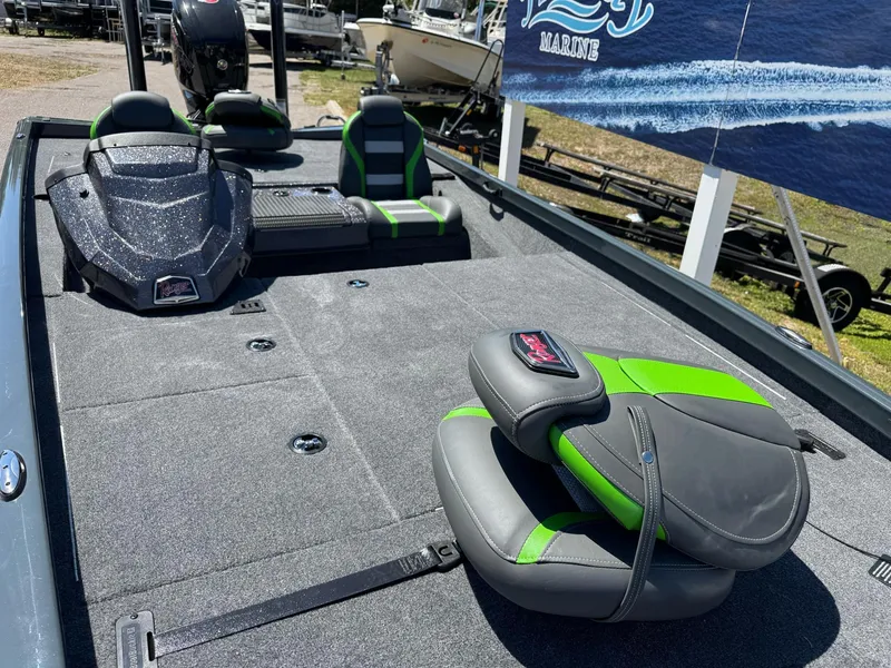 Slide: The Image of 2025 Ranger RT188P boat interior with gray and green seating, showcasing spacious deck design. - 4