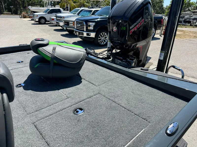 Slide: The Image of 2025 Ranger RT188P boat with Mercury engine, parked in a lot with other vehicles. - 8