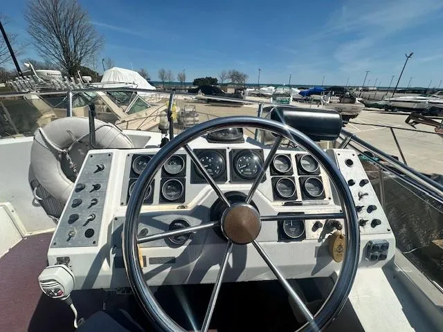 Slide: The Image of Helm of 1988 Carver 2767 Santego boat with steering wheel and instrument panel. - 15