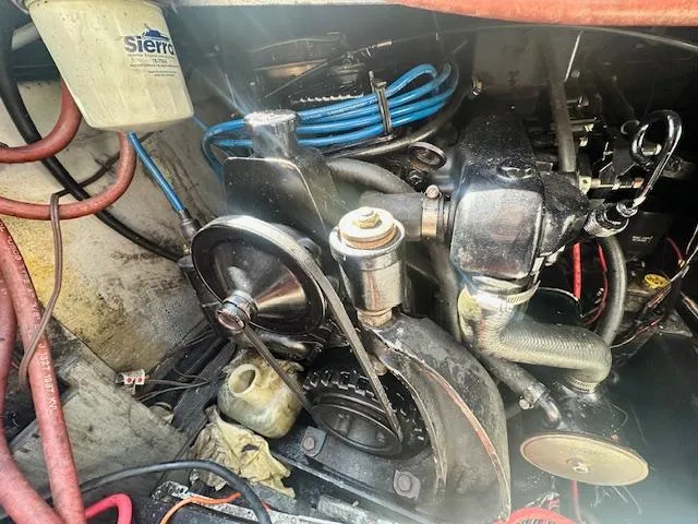 Slide: The Image of Engine compartment of a 1988 Carver 2767 Santego boat with visible components and wiring. - 25